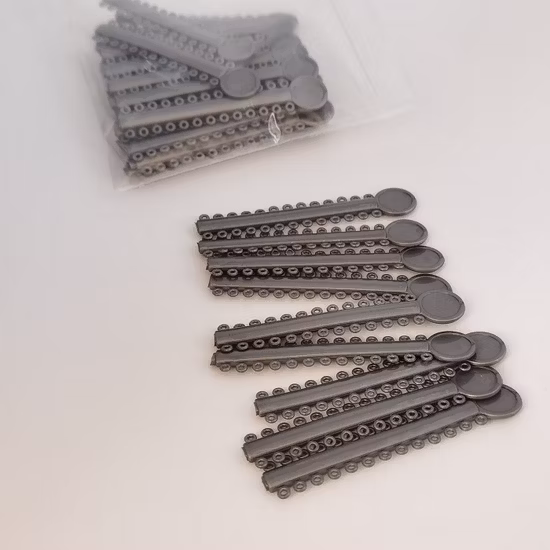 Suministros de Ortodoncia Dental, corbata de ligadura de llave elástica de Ortodoncia de 40 colores